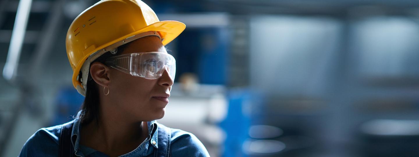 Contractor wearing a hard hat and safety glasses